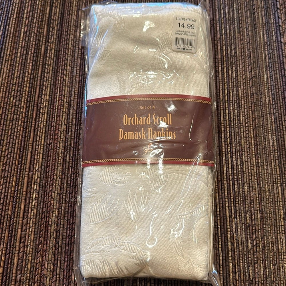 3 packs of 4 (12 total) cream damask napkins